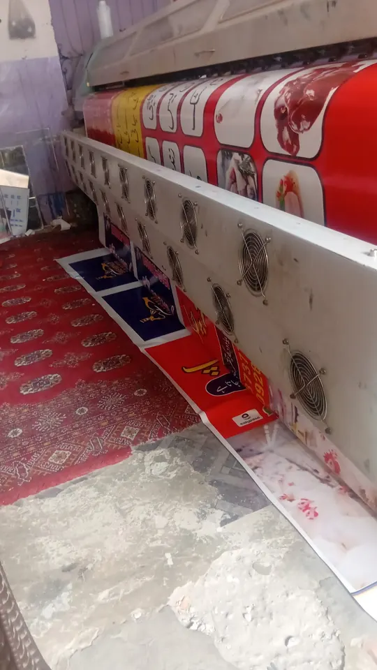 A panaflex print coming off the large-format machine at Digital World